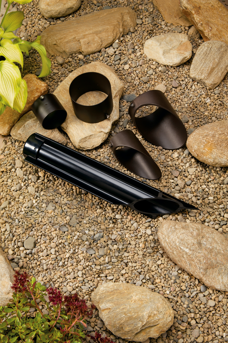 Assortment of accessories on a beige gravel background